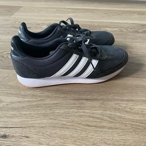 Blue Adidas with white stripes